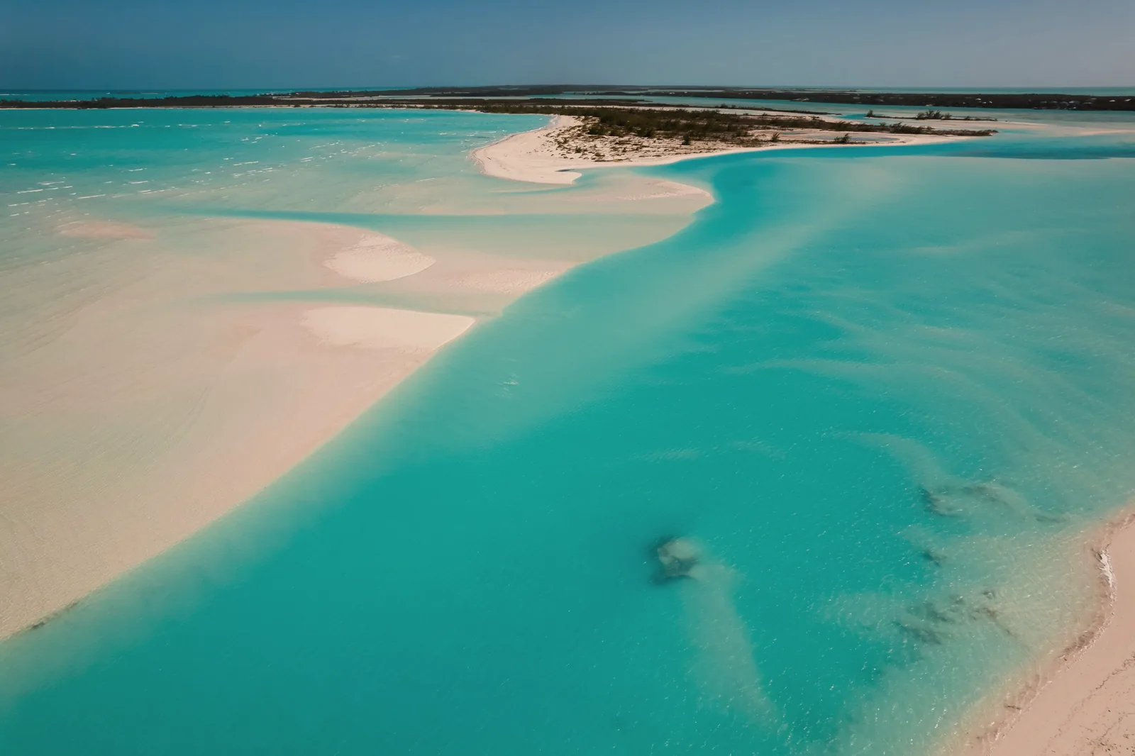A white sandbar in turquoise water in the Exumas, Bahamas